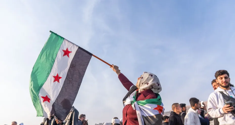 Syrians holding 'revolution flag' gather to celebrate the collapse of Assad regime