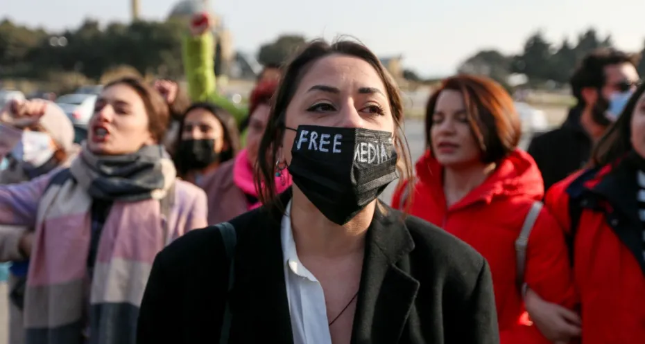 Women journalist protesting in Azerbaijan