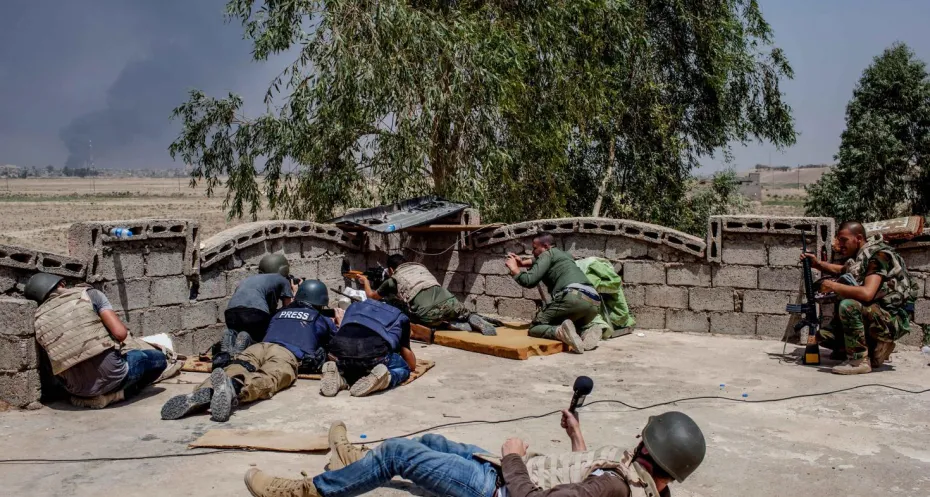 Journalist at work in conflict area 